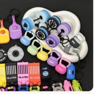 In-stock gym and fitness keychains: dumbbell, kettlebell, weight plate, Pilates reformer, pickleball paddle and shaker bottle keychains