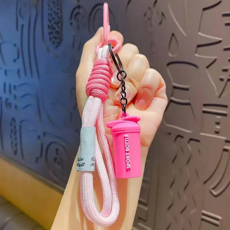 Pink sport bottle keychain on a pink braided wrist strap with clip